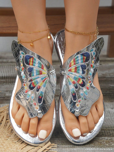 These Stylish Silver Butterfly Embroidery Toe-Ring <a href="https://canaryhouze.com/collections/women-canvas-shoes" target="_blank" rel="noopener">Sandals</a> are the perfect choice for the upcoming summer season. Featuring a stunning butterfly embroidery design, these sandals add a touch of elegance to any outfit. The toe-ring design adds a secure fit, making them perfect for long walks and outdoor activities. Elevate your summer style with these beautiful and trendy sandals.