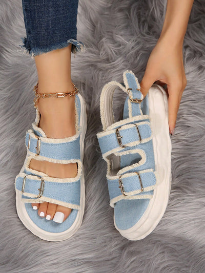 These Light Blue Beach Double Buckle Flat <a href="https://canaryhouze.com/collections/women-canvas-shoes" target="_blank" rel="noopener">Sandals</a> are the perfect choice for fashion-savvy women looking for stylish and comfortable slip-on footwear. The double buckle design adds a touch of sophistication while the light blue color is perfect for the beach. Slip them on and step out in style!