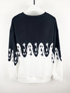 This Spooky Chic pullover sweatshirt is perfect for Halloween and the fall/winter seasons. Featuring bold, colorful ghost prints, this stylish sweatshirt is made from soft and cozy fabric that keeps you toasty and comfortable all season long. Add a touch of Halloween spirit to any outfit with this cozy and chic pullover.