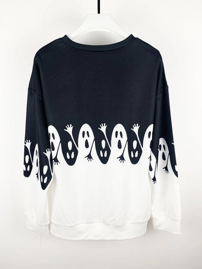 This Spooky Chic pullover sweatshirt is perfect for Halloween and the fall/winter seasons. Featuring bold, colorful ghost prints, this stylish sweatshirt is made from soft and cozy fabric that keeps you toasty and comfortable all season long. Add a touch of Halloween spirit to any outfit with this cozy and chic pullover.