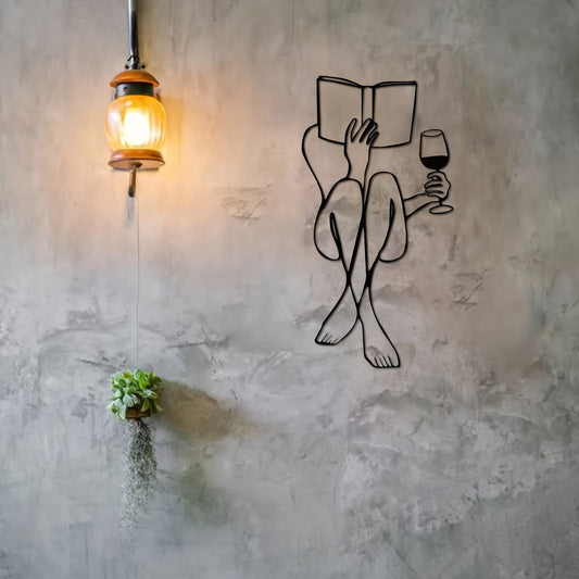 This contemporary metal wall decor features a stunning and minimalist line art design of women reading a book. The sleek and modern design adds a touch of elegance to any room, while the durable metal construction ensures long-lasting quality. Perfect for any avid reader or lover of modern decor.