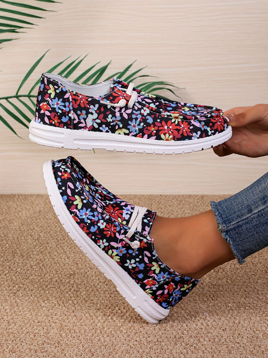 This pair of fashionable women's slip-on shoes is crafted of lightweight canvas, featuring a beautiful flower pattern. They are designed for maximum comfort and style, perfect for casual everyday wear.