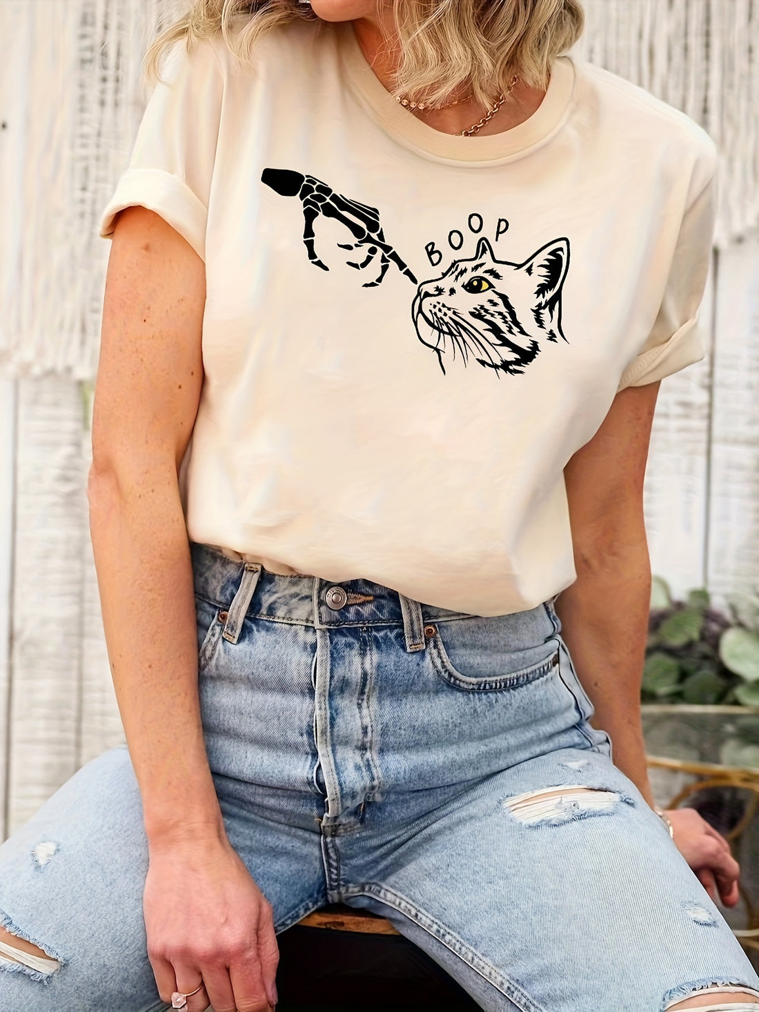 Elevate your style with our Edgy and Chic Skeleton Hand Cat Print T-Shirt! Perfect for the spring and summer months, this must-have shirt features a unique design that will make you stand out. Made with high-quality materials, it's both comfortable and stylish. Upgrade your wardrobe today!