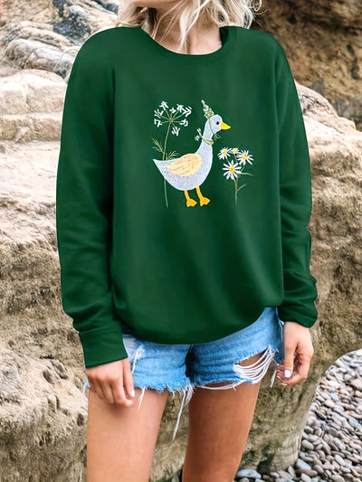 This Women's Loose Sweatshirt is made of a comfortable cotton blend that is perfect for the season. The front features a cute duck print with lettering, perfect for casual everyday wear. Enjoy easy movement with the loose fit and long sleeves.