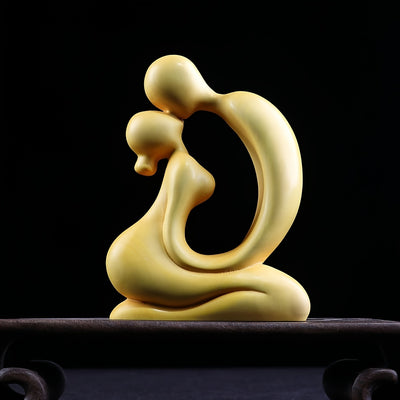 Add a touch of elegance and love to your home decor with the Intertwined Love Boxwood Couple's Carving. Meticulously crafted from boxwood, this exquisite piece symbolizes eternal togetherness and makes for a meaningful gift. Display it proudly in your home and cherish the beauty of intertwined love.