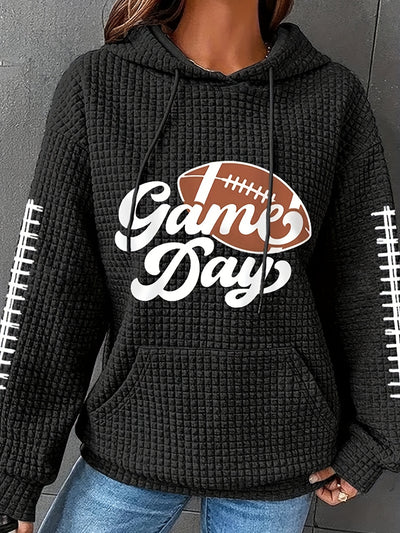 Our Women's Plus Size Casual Hoodie is made with soft waffle knit fabric that is comfortable and stylish. This hoodie features a football-inspired letter print, drawstring hood, kangaroo pockets, and curved hem for a flattering fit. Keep cozy and stylish in this comfortable hoodie.