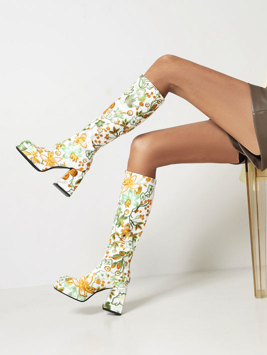 These fashion-forward Women's Flower Pattern Chunky Heel Boots will be a stylish addition to your wardrobe. Combining a square toe design with a slip-on silhouette, the comfortable boots reach up to knee-height for a leg-lengthening look. The chunky heel adds a timeless touch.