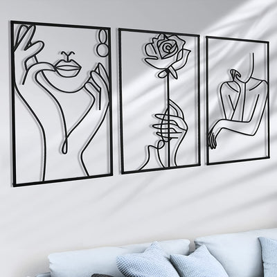 This sleek metal wall art features a simple silhouette of a female body in an abstract line design. An elegant home decor choice, this sign makes an ideal hanging piece to show off the perfect combination of style and beauty.