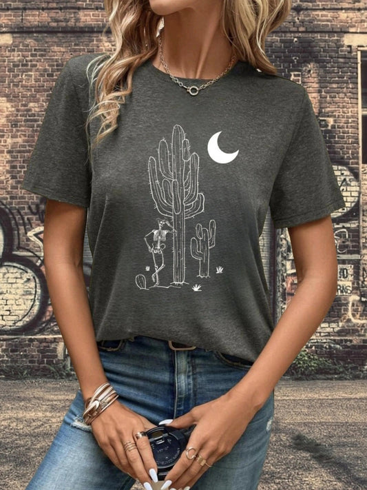 Look stylish while embracing the beauty of Spring and Summer by wearing this Mystical Charm: Skull Cactus Moon Print T-Shirt for Women. It features a subtle and eye-catching design, combining an elegant cactus pattern with a skull. Perfect for a day out in the sun!