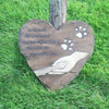 Say goodbye to your beloved pooch with this personalized pet memorial. Crafted from natural stone, this tombstone is engraved with angel wings and features space for a personalized message. It's the perfect way to honor your pet and cherish their memory.