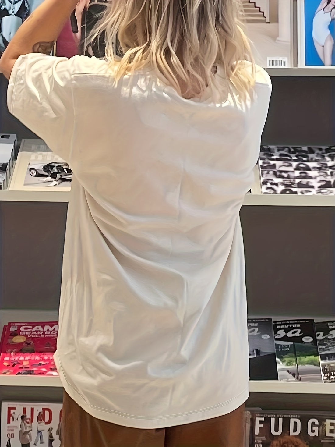 Look effortlessly stylish this season in this lightweight crew neck T-shirt. It features a bold letter graphic print and a relaxed fit for a modern and trendy summer look. Perfect for everyday wear.