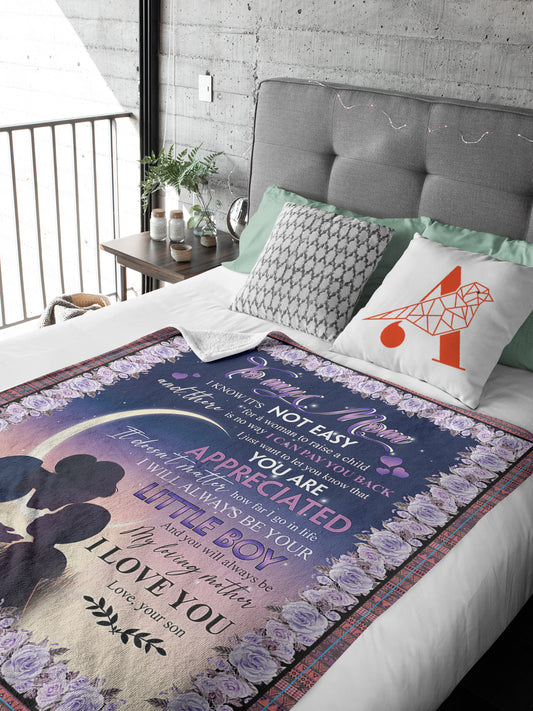 Make Mom feel special with this luxurious Under The Moon Blanket. This product is a perfect gift for Mother's Day and is crafted with the highest quality materials. Featuring a beautiful design of the moon, it guarantees superior warmth and comfort. Snuggle up and let Mom know she's appreciated.