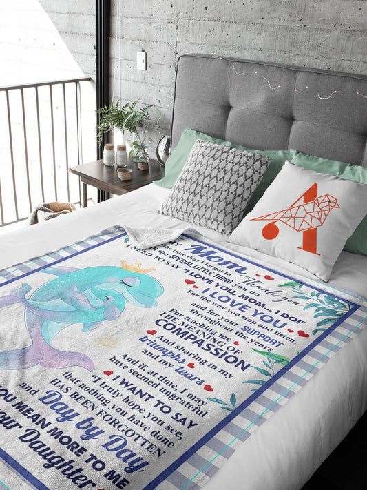 The Blanket Dolphin Family, Mother's Day Gift is perfect for making Mom feel special. This cozy blanket is made of the softest material and features a beautiful dolphin family with a message of love. Make Mom's day with this meaningful gift!