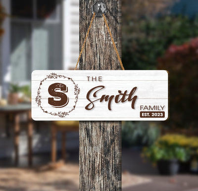 Welcome your family and guests with our Personalized The Family Wood Sign. Crafted from pine wood, this custom sign displays your family's name in an elegant font. Perfect for indoor and outdoor use, this sign is guaranteed to bring a classic, timeless look to your home.