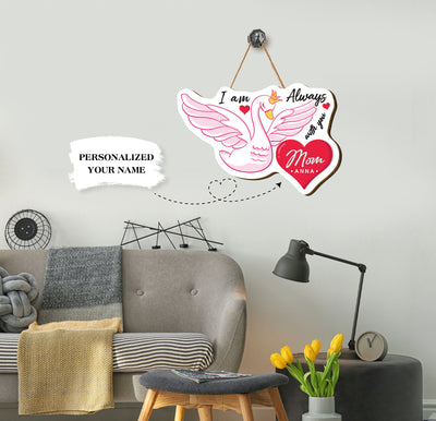 This Personalized Name Wood Sign is the perfect Mother's Day gift. It is a pink swan plywood sign with the words "I am always with you" etched into it. The customizable name ensures a special and meaningful touch.