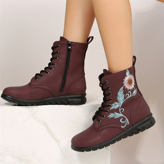 This stylish combat boot features embroidered floral details to add a chic touch to your casual look. Its lace-up and side zipper closure provide a secure fit with ease. Comfortably lined with soft fabric, it offers both a stylish and comfortable wear.
