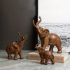 Experience the majesty of the Wood Grain Resin Elephant Décor as it adds a touch of elegance to your living room. With its intricate wood grain design and durable resin material, this décor piece is both beautiful and long-lasting. Elevate your home with this stunning addition.