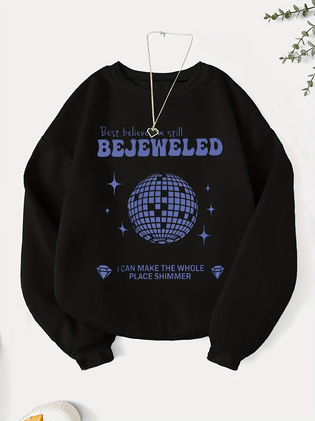 Add a touch of glamour to your wardrobe with our Glamorous Geometric Infusion sweatshirt for women. This eye-catching piece features a stunning bejeweled-letter graphic print that is sure to make a statement. Made with high-quality materials, this sweatshirt offers both style and comfort. Elevate your wardrobe with this must-have piece.