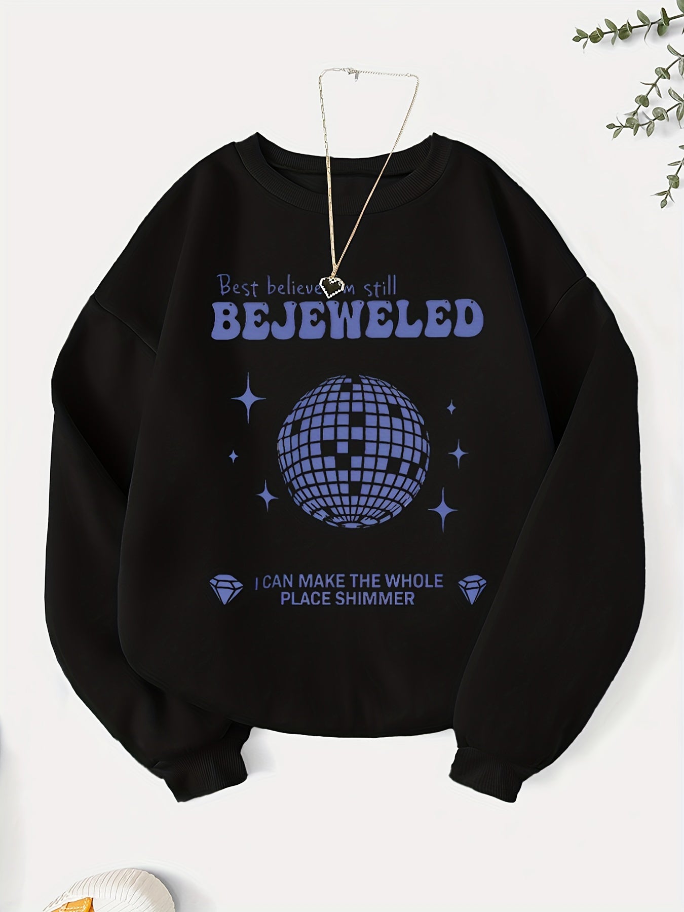 Add a touch of glamour to your wardrobe with our Glamorous Geometric Infusion sweatshirt for women. This eye-catching piece features a stunning bejeweled-letter graphic print that is sure to make a statement. Made with high-quality materials, this sweatshirt offers both style and comfort. Elevate your wardrobe with this must-have piece.