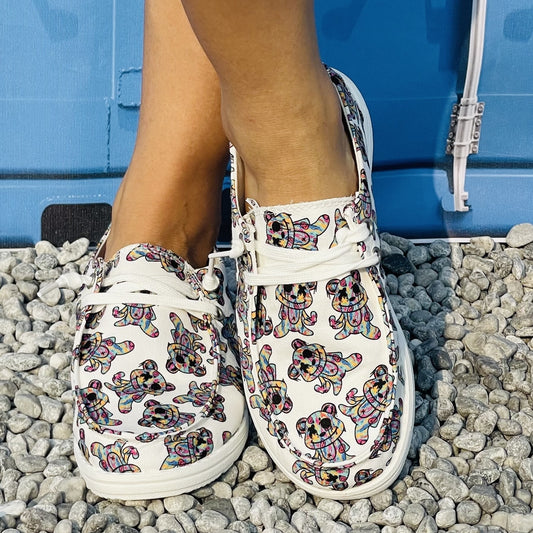 These Women's Cartoon Bear Print Slip-On Canvas Shoes offer lightweight yet durable outdoor comfort. Featuring a non-slip sole and a cartoon bear print design, these shoes are perfect for all day comfort and style.