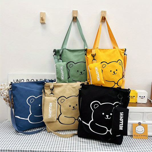 Stay stylish and organized on your adventures with our Cute Bear Adventure Crossbody Bag Set. Made from durable canvas, this spacious shoulder bag is accompanied by a little pouch for added style and convenience. Perfect for any outing, this set is the ultimate combination of fashion and functionality.