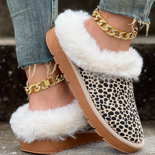 These Leopard Pattern Fluffy Slip-On Shoes offer a stylish, cozy winter look with their furry, leopard print design. The slip-on feature ensures a snug fit that will keep your feet warm and comfortable all winter long. Enjoy a fashionable, comfortable winter look.