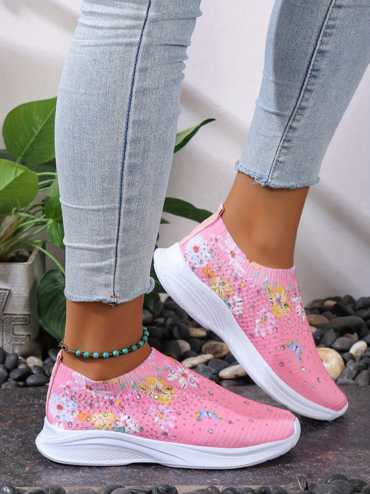 Experience comfort and style with these Women's Floral Rhinestone Decor Sneakers. These lightweight slip-on shoes feature a floral rhinestone decor detail and cushioned footbed for comfort. Perfect for casual everyday wear.