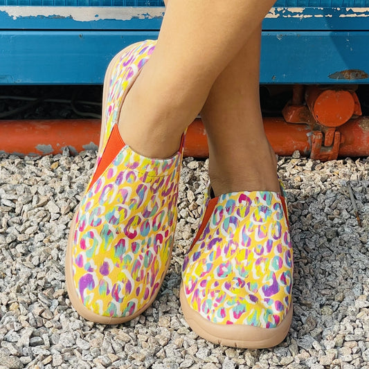 Stay stylish and comfortable with these women's colorful print canvas shoes. Crafted with lightweight upper fabric, these slip-on sneakers provide superior breathability and cushioning, allowing for hours of casual walking. Get the perfect fit every time with the elastic band at the top that keeps the shoes securely in place.