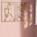 Infuse artistry into any space with this unique metal sign decor. Featuring a detailed silhouette of a female body with abstract line art, this metal sign is an elegant way to enhance any wall. Its high-quality craftsmanship provides an exquisite visual experience.