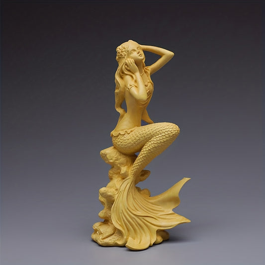 Experience the captivating beauty of our Enchanting Mystique wood carving mermaid. Handcrafted from boxwood, this mesmerizing piece is not just a decoration, but a stunning work of art. Admire the intricate details of the human body, expertly captured in this enchanting sculpture. A must-have for any art lover or interior decorator.