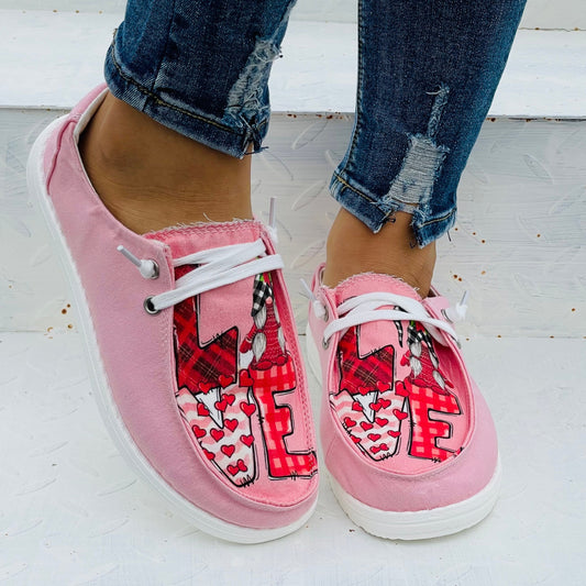 These Women's Cartoon Letter Print Slip-On Loafers are lightweight and comfortable, perfect for all-day casual wear. Crafted from a breathable canvas material, these shoes add a stylish touch of detail with their cartoon letter print design.
